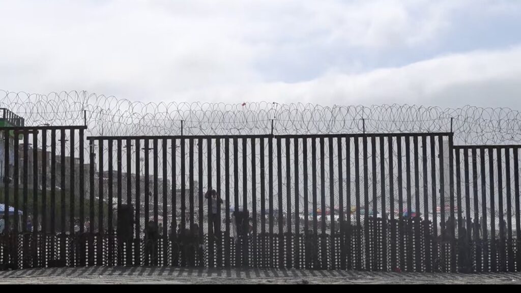 The US–Mexico border fence on the beach at Friendship Park, from The Border Church